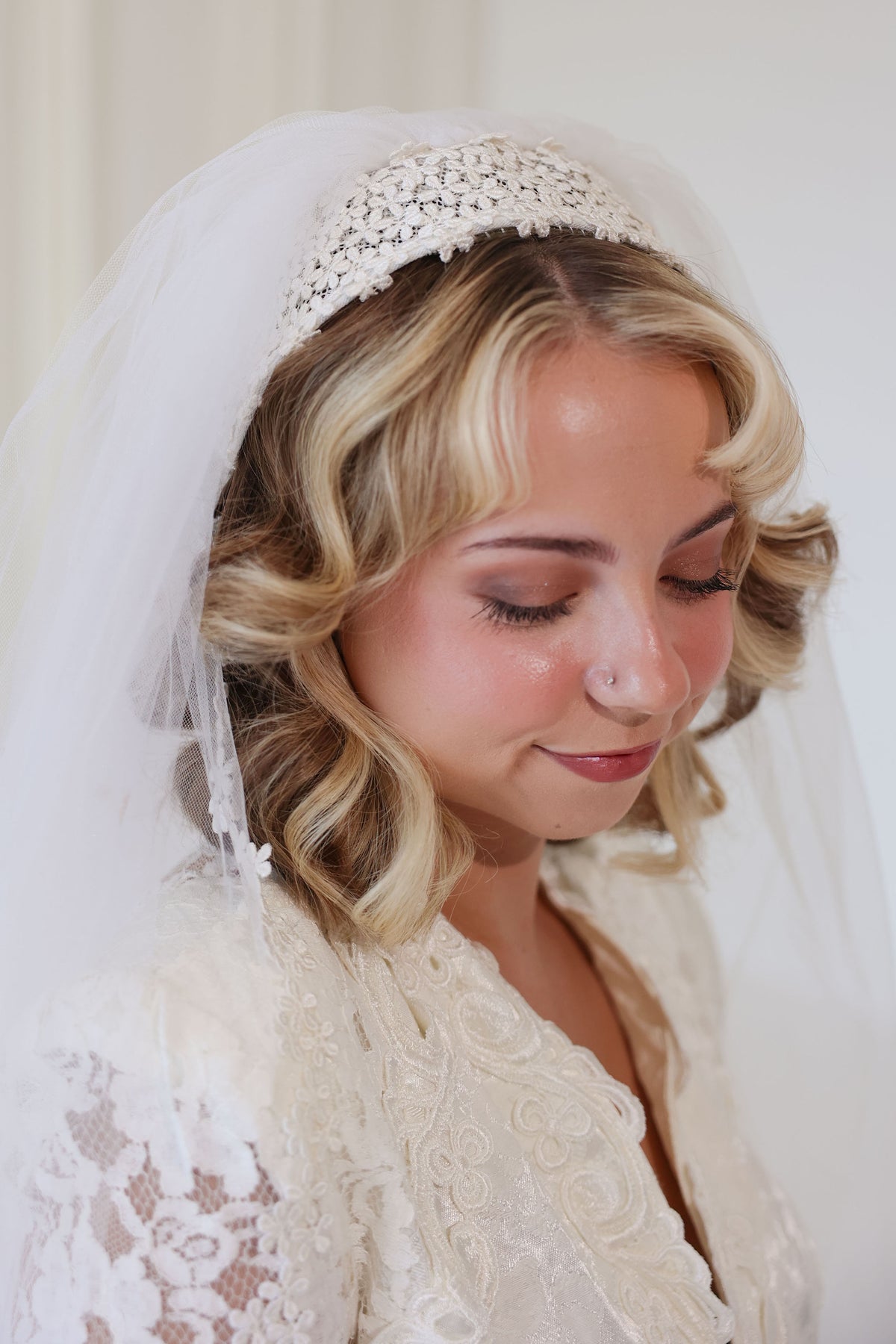 Bride wearing 1960s vintage floral cap style wedding veil