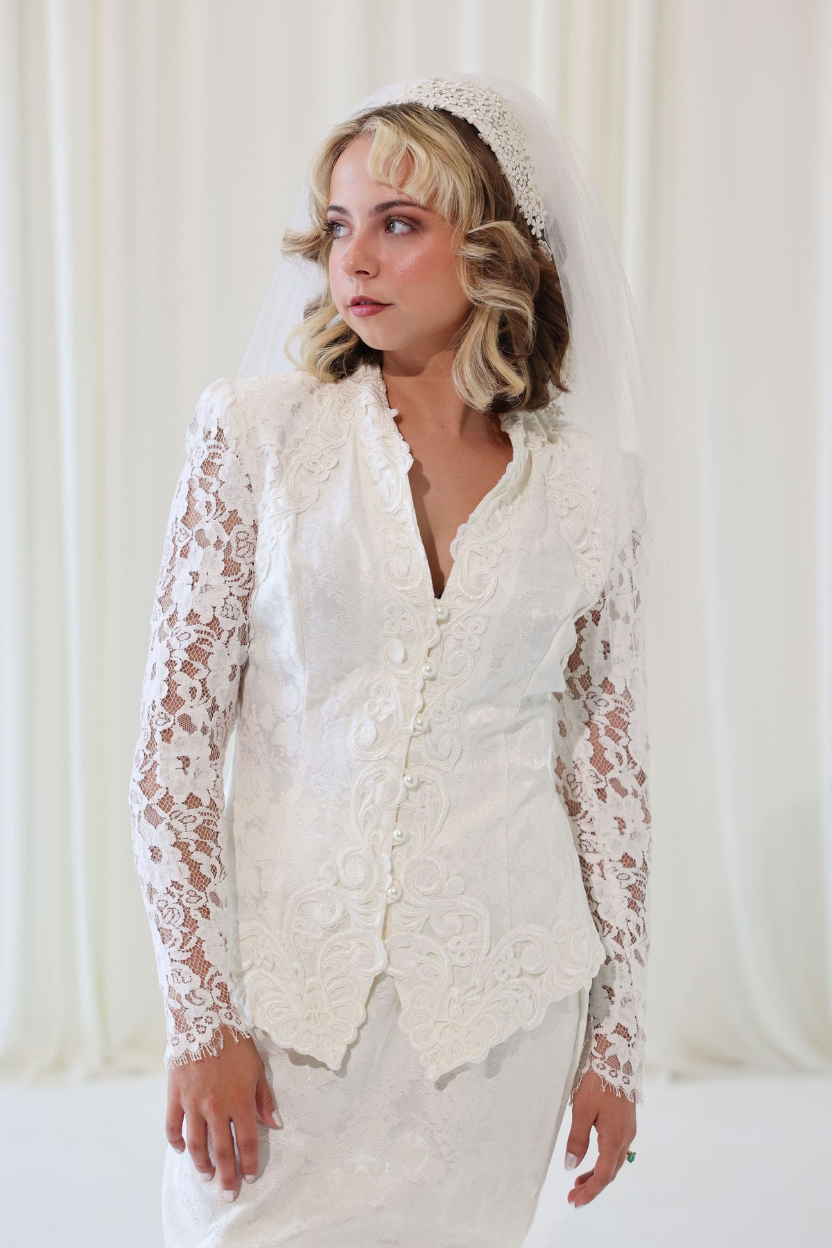 Bride wearing 1960s vintage floral cap style wedding veil