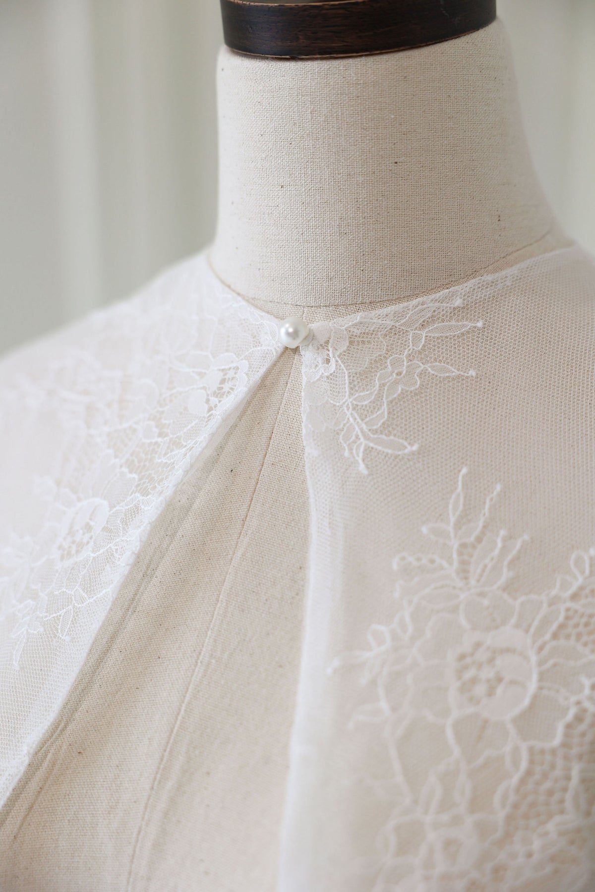 Bride Wearing Lace Bridal Cape over Wedding Dress