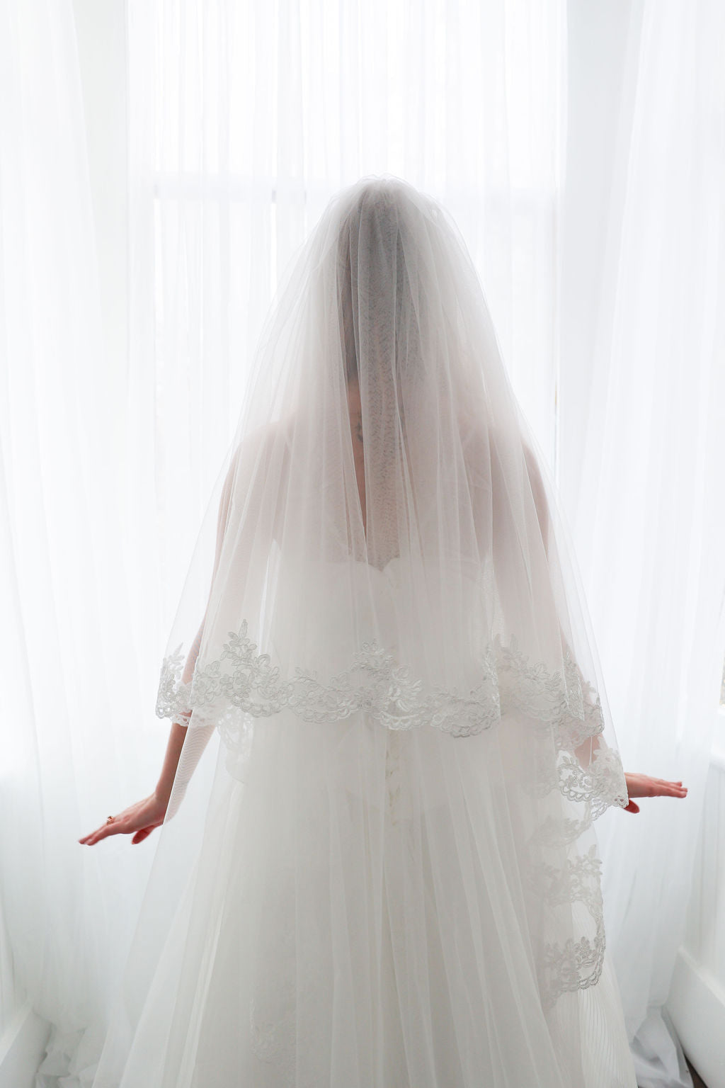 Bride Wearing Cathedral Length Lace Blusher Veil
