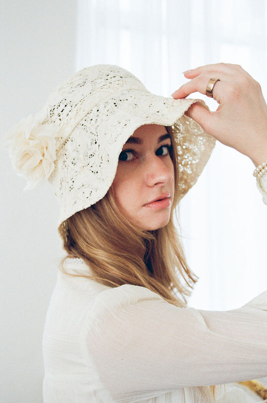 Bride wearing vintage lace bridal cap