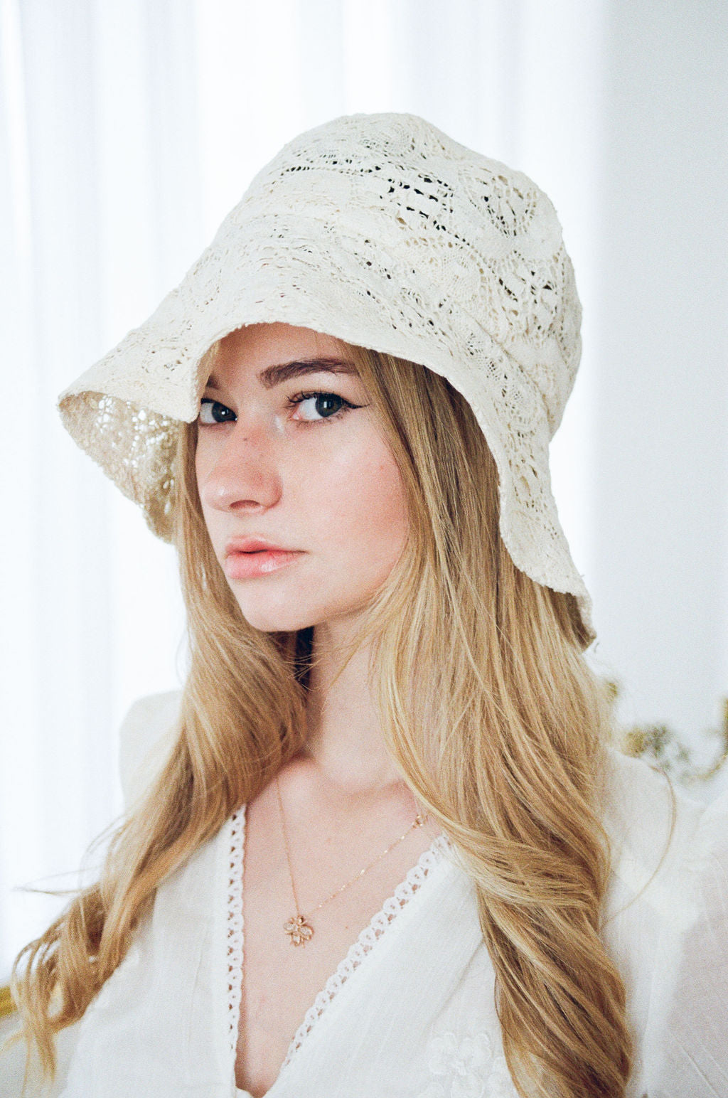 Bride wearing vintage lace bridal cap
